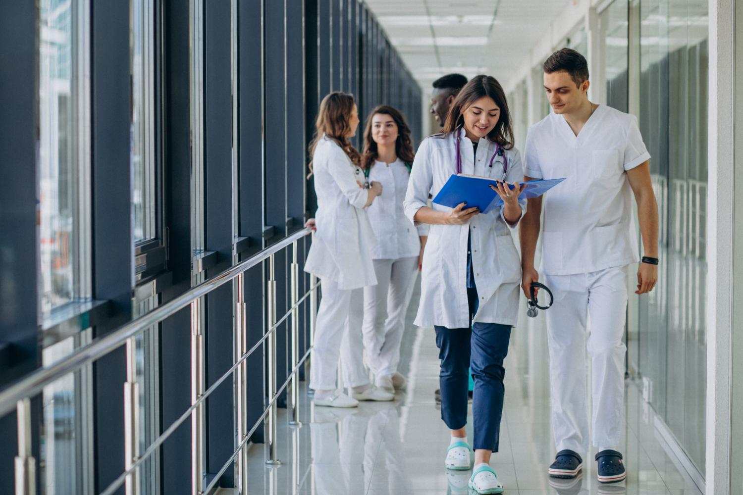 InHealth clinicians in a hospital corridor